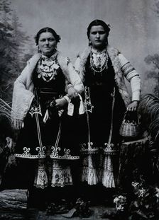 Two Bulgarian women arm-in-arm wearing national dress, c1900. Creator: Unknown