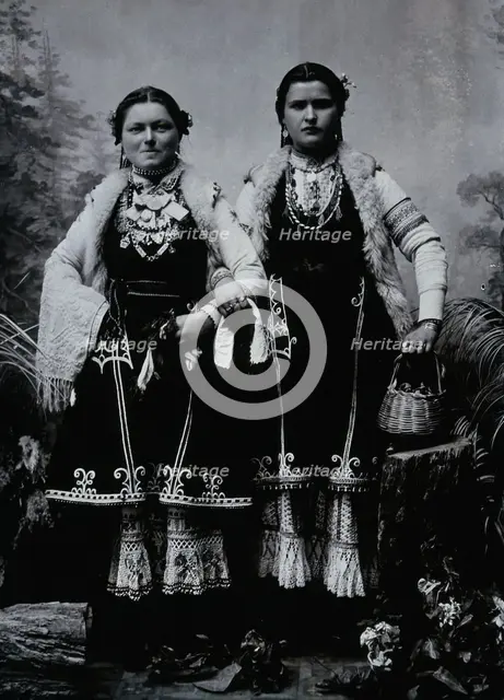 Two Bulgarian women arm-in-arm wearing national dress, c1900. Creator: Unknown.