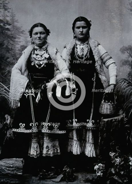 Two Bulgarian women arm-in-arm wearing national dress, c1900. Creator: Unknown.