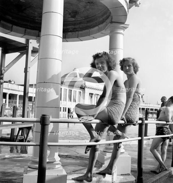 Two bathing beauties pose for the camera in the Blackpool Lido, c1946-c1955. Artist: John Gay