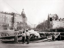 Two boys by a canal, Rotterdam, 1898.Artist: James Batkin