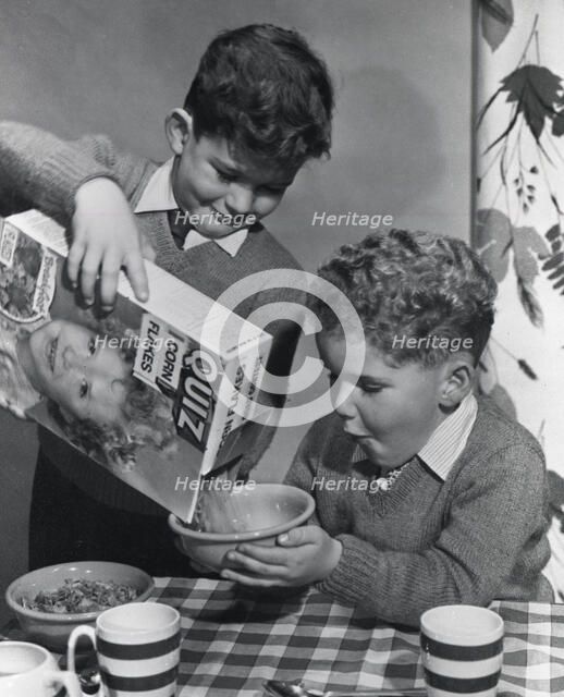 Two boys having a bowl of Quiz Corn Flakes, c1955.  Creator: Arthur Charles Kirby Ware.