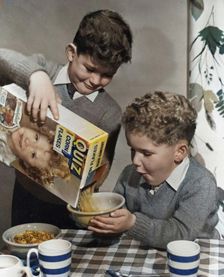 Two boys having a bowl of Quiz Corn Flakes, c1955. Creator: Arthur Charles Kirby Ware