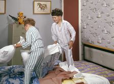 Two boys having a pillow fight, c1955. Creator: Arthur Charles Kirby Ware