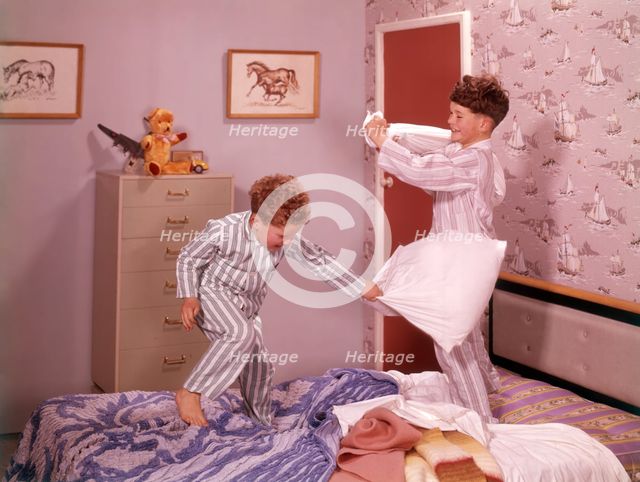 Two boys having a pillow fight, c1955.  Creator: Arthur Charles Kirby Ware.