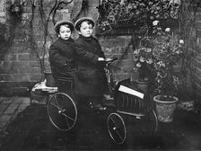 Two boys in a pedal car, (early 20th century?)