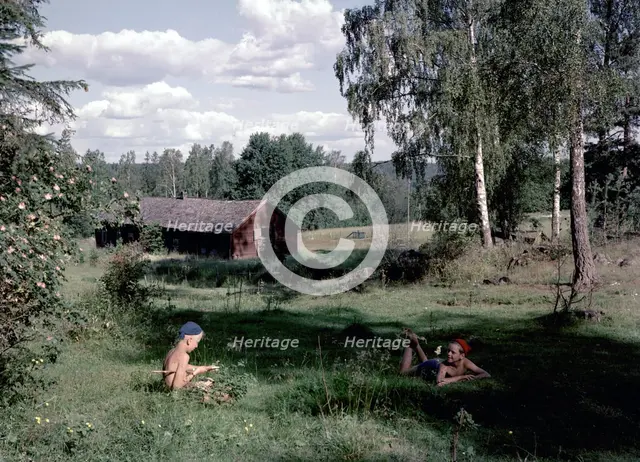 Two boys in the countryside during their summer holidays, Sweden, 1950s. Creator: Karl Sandels.