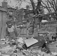 Two boys playing in their backyard, Washington (southwest section), D.C., 1942. Creator: Gordon Parks
