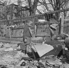 Two boys playing in their backyard, Washington (southwest section), D.C., 1942. Creator: Gordon Parks