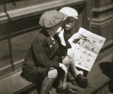 Two boys reading the comic section of the Sunday paper, New York, USA, 1931