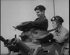 Two British Tank Operators Looking Out of a Tank Turret, 1940. Creator: British Pathe Ltd