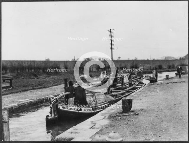 Two canal barges passing through a lock on the Grand Union Canal near Marsworth, Bucks, 1920-50.  Creator: George R Long.