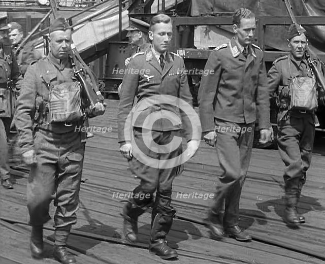 Two Captured German Pilots Being Escorted Away, 1940. Creator: British Pathe Ltd.