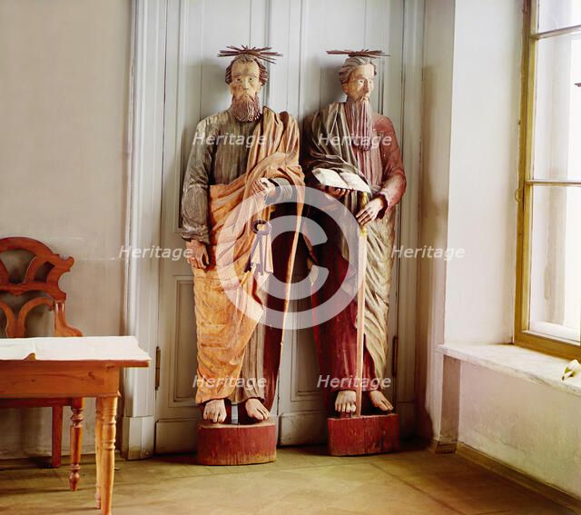 Two carved wooden statues of bearded men with haloes above their head..., between 1905-1915. Creator: Sergey Mikhaylovich Prokudin-Gorsky.
