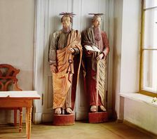 Two carved wooden statues of bearded men with haloes above their head..., between 1905-1915. Creator: Sergey Mikhaylovich Prokudin-Gorsky