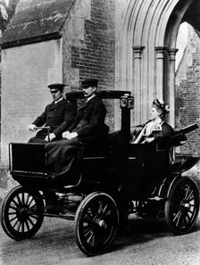 Two chauffeurs driving a convertible City and Suburban electric car