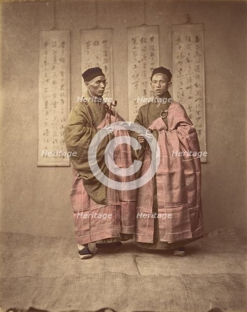 [Two Chinese Men in Matching Traditional Dress], 1870s. Creator: Unknown.
