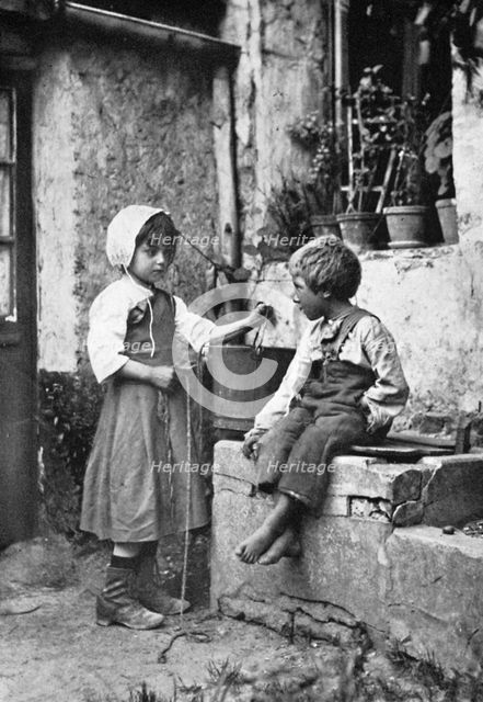 Two children in a backyard, 902-1903.Artist: Constance Ellis