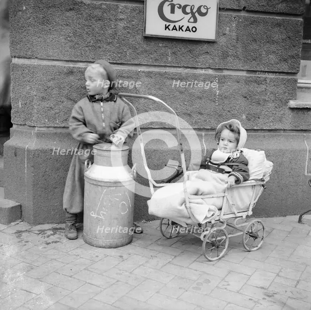 Two children in the street, Sweden. Creator: Unknown.