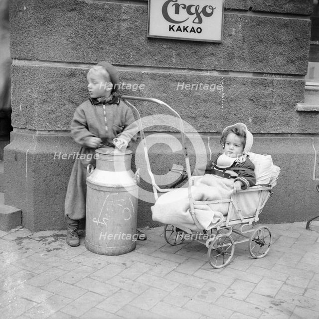 Two children in the street, Sweden. Creator: Unknown.