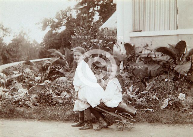 Two children playing outdoors, 1890s. Artist: Unknown