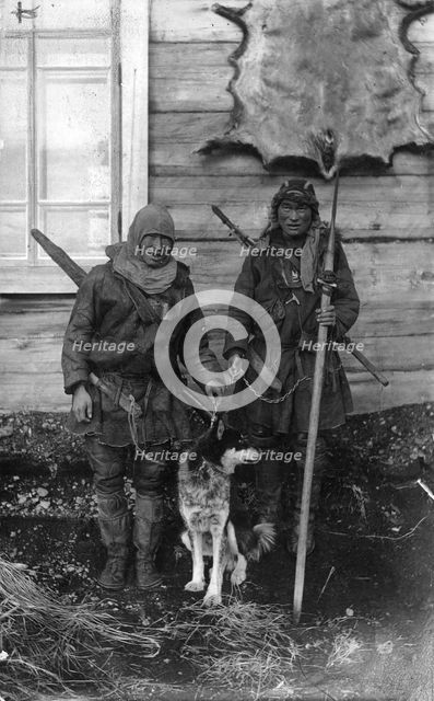Two Chukchi in national clothes, with guns and a spear, 1910-1929. Creator: Ivan Emelianovich Larin.