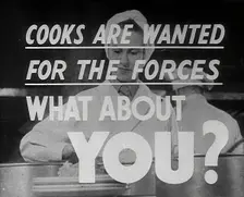 Two Cooks With a Recruitment Slogan on the Screen, 1942. Creator: British Pathe Ltd