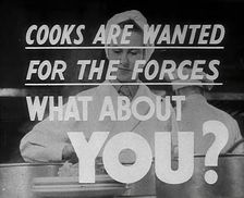 Two Cooks With a Recruitment Slogan on the Screen, 1942. Creator: British Pathe Ltd