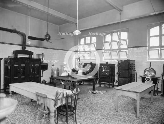 Two cooks working in the kitchen, Guy's Hospital, Southwark, London, 1925-1939. Artist: Marshall Keene and Company.