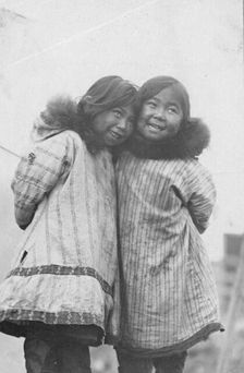 Two Eskimo girls standing side by side, between c1900 and c1930. Creator: Unknown