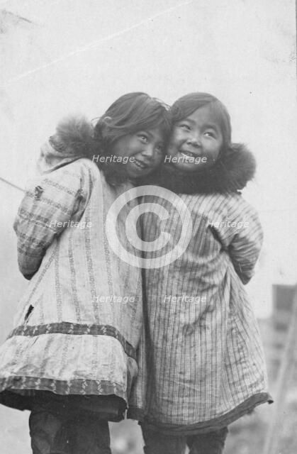 Two Eskimo girls standing side by side, between c1900 and c1930. Creator: Unknown.