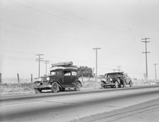 Two families originating from Independence, Kansas, U.S. 99, between Tulare and Fresno, 1939. Creator: Dorothea Lange