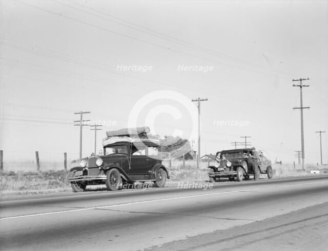 Two families originating from Independence, Kansas, U.S. 99, between Tulare and Fresno, 1939. Creator: Dorothea Lange.