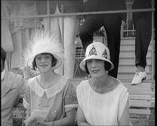 Two Female Civilians at a Horse Race Event Wearing Smart Summer Outfits and Hats, 1920. Creator: British Pathe Ltd
