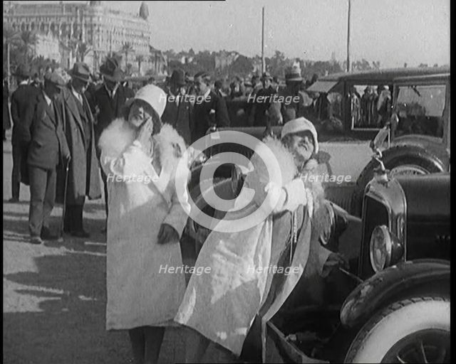 Two Female Civilians Wearing Glamorous Outfits Powdering Their Noses Using a Luxurious..., 1920. Creator: British Pathe Ltd.