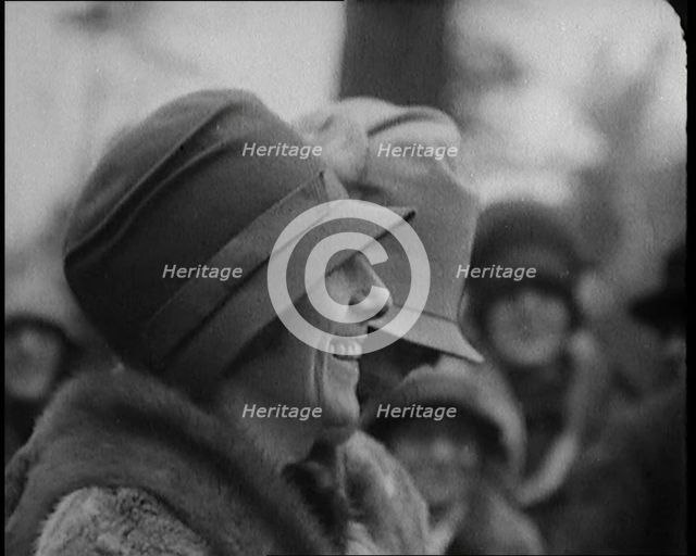 Two Female Civilians Wearing Heavy Coats and Hats Standing in Front of a Car, 1920. Creator: British Pathe Ltd.