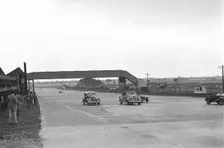 Two Ford V8s and a MG PB at the MCC Members Day, Brooklands, 1938 or 1939. Artist: Bill Brunell