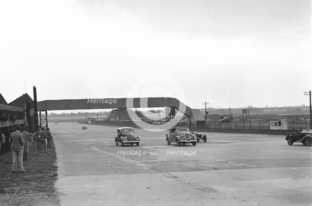 Two Ford V8s and a MG PB at the MCC Members Day, Brooklands, 1938 or 1939. Artist: Bill Brunell.