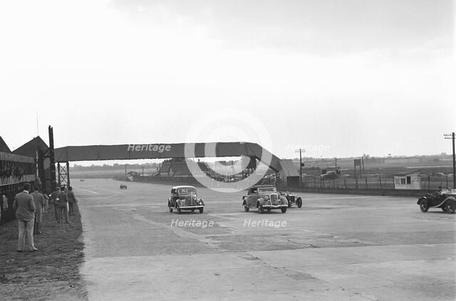 Two Ford V8s and a MG PB at the MCC Members Day, Brooklands, 1938 or 1939. Artist: Bill Brunell.