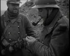 Two French Soldiers Standing in a Trench and One is Smoking a Pipe, 1939. Creator: British Pathe Ltd