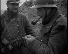 Two French Soldiers Standing in a Trench and One is Smoking a Pipe, 1939. Creator: British Pathe Ltd
