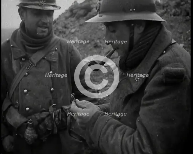Two French Soldiers Standing in a Trench and One is Smoking a Pipe, 1939. Creator: British Pathe Ltd.