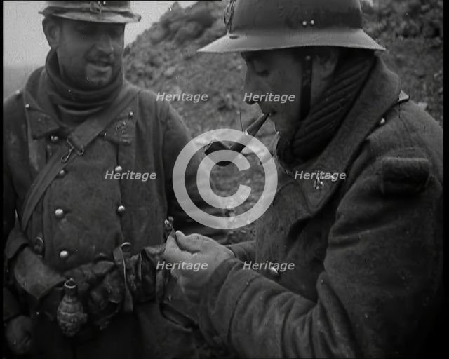 Two French Soldiers Standing in a Trench and One is Smoking a Pipe, 1939. Creator: British Pathe Ltd.