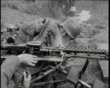 Two German Soldiers Firing a Machine Gun..., 1937. Creator: British Pathe Ltd