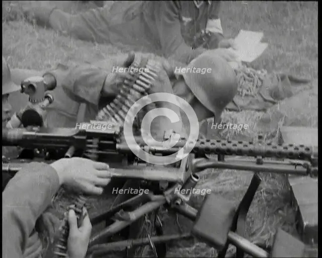Two German Soldiers Firing a Machine Gun..., 1937. Creator: British Pathe Ltd.