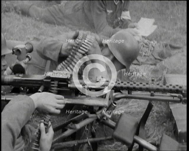 Two German Soldiers Firing a Machine Gun..., 1937. Creator: British Pathe Ltd.