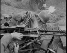 Two German Soldiers Firing a Machine Gun..., 1937. Creator: British Pathe Ltd