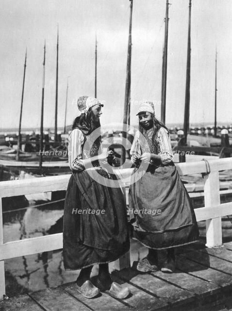 Two girls on the landing stage, Marken, Netherlands, c1934. Artist: Unknown