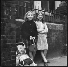 Two girls collecting pennies for the guy Westport Road, Burslem, Stoke-on-Trent, 1965-1968. Creator: Eileen Deste
