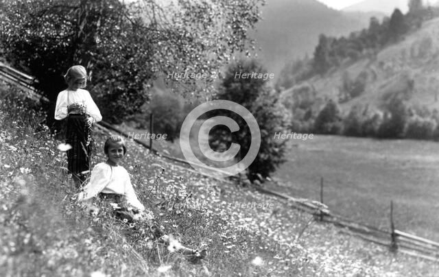 Two girls in a meadow, Bistrita Valley, Moldavia, north-east Romania, c1920-c1945. Artist: Adolph Chevalier